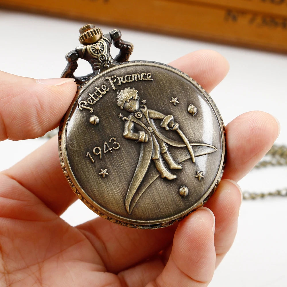 SHUHANG Adults Quartz Analog Display Antique Brown-Bronze Round Shaped Metal Alloy Case Acrylic Face Arabic Numeral Engraved Petite France 1943 Year-Night Sky-Stars-Planets Background Little Boy Holding A Sword In His Hand Design Chain-Pocket Watches