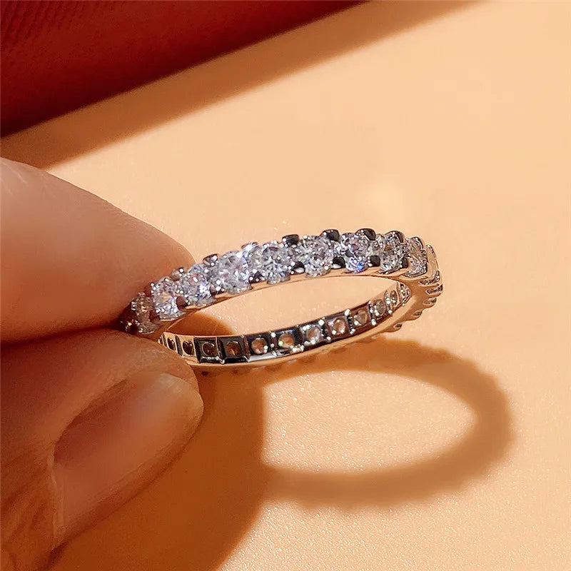 HUITAN Women Geometric Round Shaped Brass Shiny Crystal Silver Cubic Zirconia Promise Wedding Band Rings/Ring Sizes: 6-7-8-9-10/Colors-Silver/Geometric