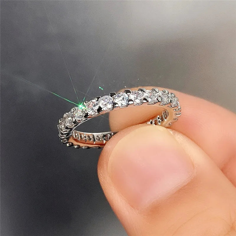 HUITAN Women Geometric Round Shaped Brass Shiny Crystal Silver Cubic Zirconia Promise Wedding Band Rings/Ring Sizes: 6-7-8-9-10/Colors-Silver/Geometric