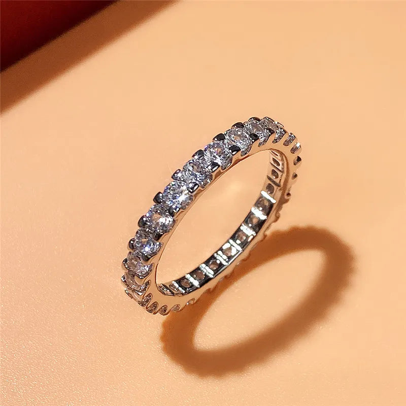 HUITAN Women Geometric Round Shaped Brass Shiny Crystal Silver Cubic Zirconia Promise Wedding Band Rings/Ring Sizes: 6-7-8-9-10/Colors-Silver/Geometric