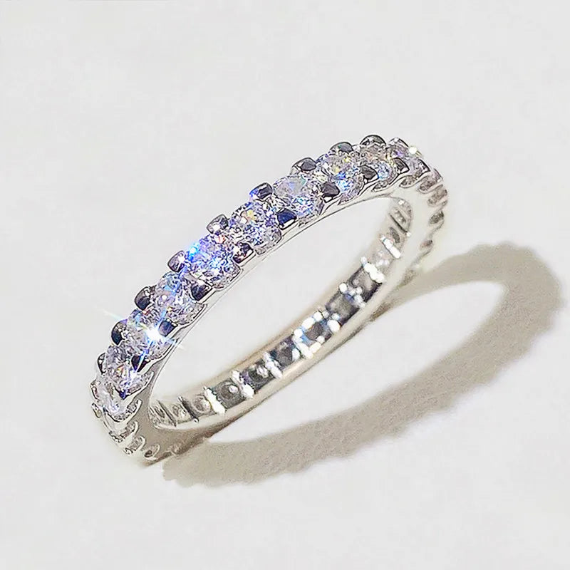 HUITAN Women Geometric Round Shaped Brass Shiny Crystal Silver Cubic Zirconia Promise Wedding Band Rings/Ring Sizes: 6-7-8-9-10/Colors-Silver/Geometric